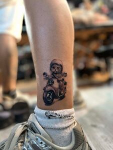A cat confidently drives a motorcycle, donning a helmet, embodying a whimsical sense of adventure.