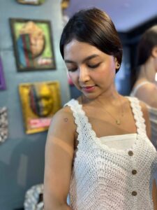 Cute and simple mini heart tattoo on the shoulder.