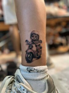 A cat confidently drives a motorcycle, donning a helmet, embodying a whimsical sense of adventure.